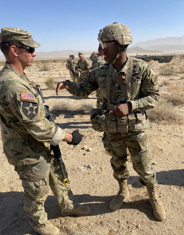 CSM Montrell L. Kea talks about CLIX distribution with an NCO from a rotational training unit at the National Training Center. CSM Montrell L. Kea talks about CLIX distribution with an NCO from a rotational training unit at the National Training Center.