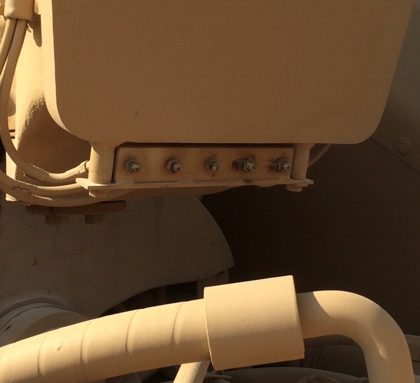 Close up of a bank of grease fittings.