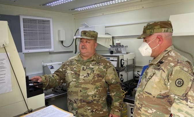 SFC William Edwards (left) inspecting equipment in the Petroleum Quality Analysis-Enhance (PQAS-E) system